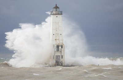 Waves crash over Frankfortýs North Pier Head. Photo by Record-Eagle/Mike Krebs